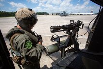 Sgt. Nicholas Prince, a crew chief with Marine Light Attack Helicopter Squadron 269, prepares to fly in a Marine Corps UH-1Y Venom at Marine Corps Air Station New River, North Carolina, July 31, 2020. HMLA-269 practiced close air support and aerial surveillance to maintain mission readiness. (U.S. Marine Corps photo by Cpl. Cody Rowe)