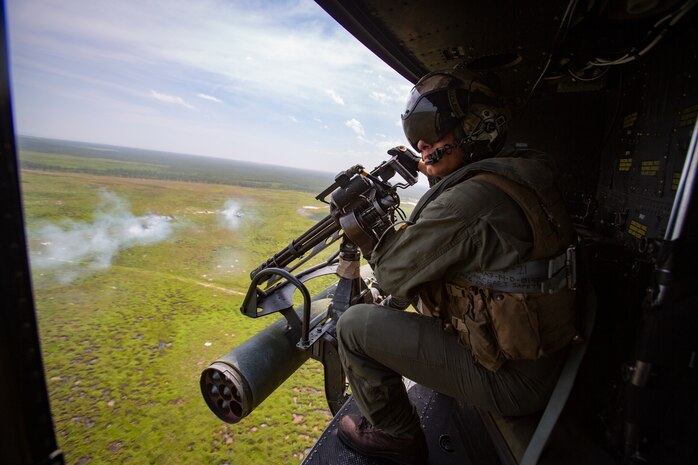 Sgt. Nicholas Prince, a crew chief with Marine Light Attack Helicopter Squadron 269, rides in a Marine Corps UH-1Y Venom over Marine Corps Base Camp Lejeune, North Carolina, July 31, 2020. HMLA-269 practiced close air support and aerial surveillance to maintain mission readiness. (U.S. Marine Corps photo by Cpl. Cody Rowe)