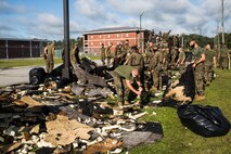 U.S. Marines currently in Marine Combat Training on Camp Geiger, clean up debris after Hurricane Isaias on Marine Corps Air Station New River, North Carolina, Aug. 4, 2020. U.S. Marines carried out recovery efforts in order to resume normal operations while following COVID-19 mitigation guidelines. (U.S. Marine Corps photo by Lance Cpl. Christian Ayers)