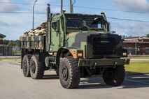 Debris from the Camp Geiger Armory is removed in a seven-ton after Hurricane Isaias on Marine Corps Air Station New River, North Carolina, Aug. 4, 2020. U.S. Marines carried out recovery efforts in order to resume normal operations while following COVID-19 mitigation guidelines. (U.S. Marine Corps photo by Lance Cpl. Christian Ayers)