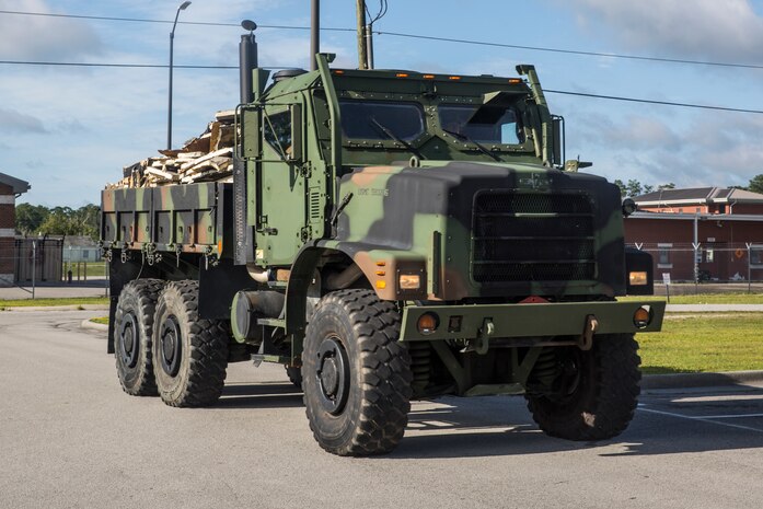 Debris from the Camp Geiger Armory is removed in a seven-ton after Hurricane Isaias on Marine Corps Air Station New River, North Carolina, Aug. 4, 2020. U.S. Marines carried out recovery efforts in order to resume normal operations while following COVID-19 mitigation guidelines. (U.S. Marine Corps photo by Lance Cpl. Christian Ayers)