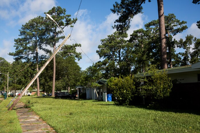 A power line lies partially fallen from Hurricane Isaias at base housing on Marine Corps Air Station New River, North Carolina, Aug. 4, 2020. U.S. Marines carried out recovery efforts in order to resume normal operations while following COVID-19 mitigation guidelines. (U.S. Marine Corps Photo by Lance Cpl. Christian Ayers)