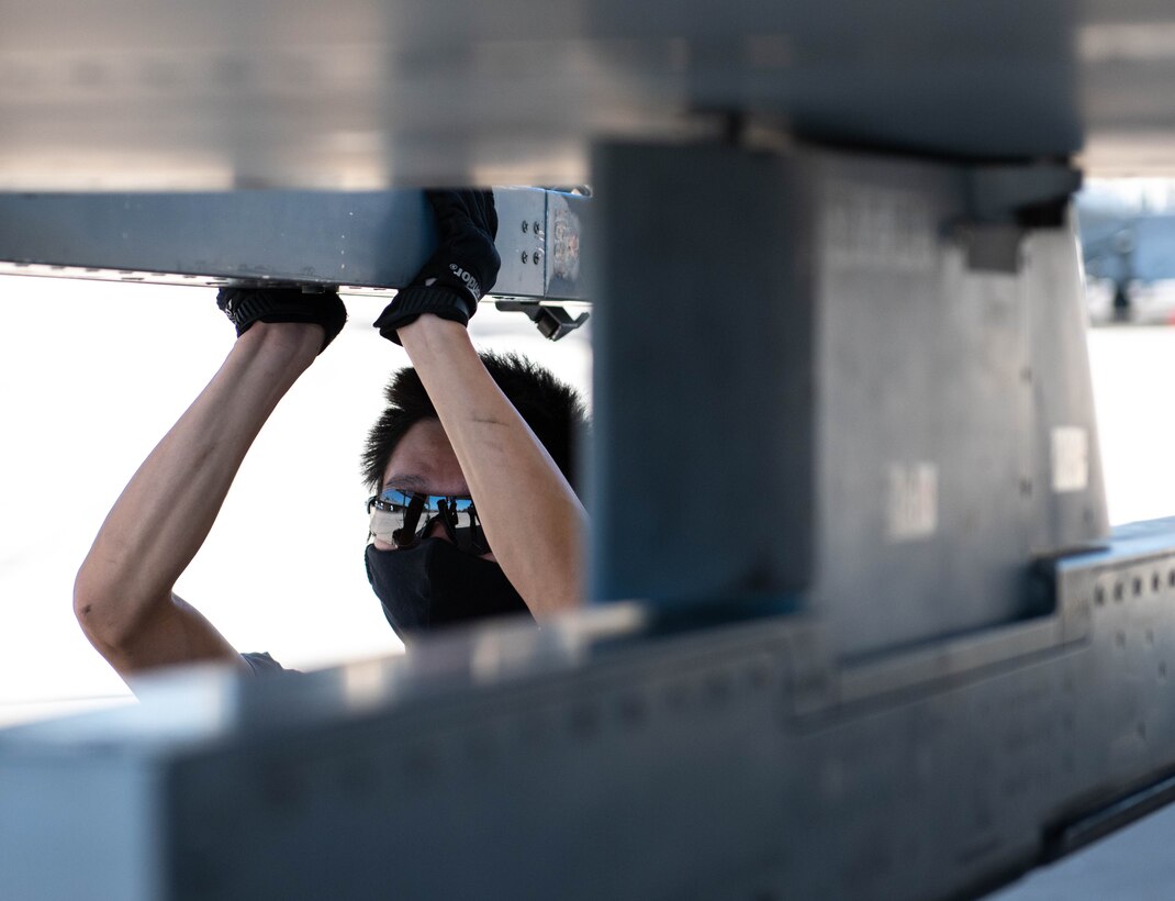 Republic of Singapore Air Force Military Expert Two Master Sgt. Tan Hock Leng, 425th Fighter Squadron maintainer, performs maintenance on an F-16D Fighting Falcon, Aug. 5, 2020, at Luke Air Force Base, Ariz.