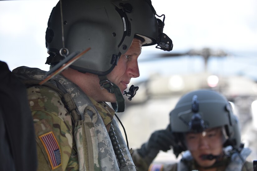 U.S. Army Capt. Richard Jackson (left), a flight doctor assigned to the 1st Battalion 228th Aviation Regiment Air Ambulance Detachment at Joint Task Force-Bravo, prepares to brief his team at Soto Cano Air Base, Honduras July 31, 2020. The Charlie Company of the 1-228th have been vital in providing emergency medical transportation throughout Honduras.