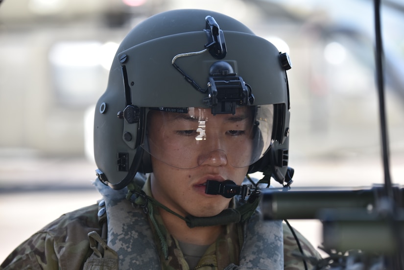 U.S. Army Staff Sgt. Steven Thai, a critical care flight paramedic assigned to the 1st Battalion 228th Aviation Regiment Air Ambulance Detachment at Joint Task Force-Bravo, reviews medical evacuation procedures at Soto Cano Air Base, Honduras July 31, 2020. Members of the 1-228th performed three life-saving aeromedical evacuations in the course of four weeks despite challenges presented by weather and COVID-19.