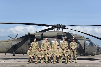 U.S. Army aircrew assigned to the 1st Battalion 228th Aviation Regiment Air Ambulance Detachment at Joint Task Force-Bravo, pose for a photo at Soto Cano Air Base, Honduras, July 31, 2020. The 1-228 Charlie Company is a vital asset, providing emergency medical transportation throughout Honduras and Central America. The 1-228 Charlie Company is comprised of just 20 members and is the only aeromedical evacuation in the U.S. Southern Command area of responsibility.