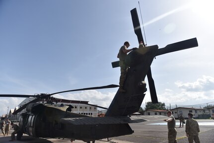 U.S. Army aircrew assigned to the 1st Battalion 228th Aviation Regiment Air Ambulance Detachment at Joint Task Force-Bravo, Charlie Company complete an aircraft maintenance inspection at Soto Cano Air Base, Honduras July 31, 2020. Members of the 1-228th performed three life-saving aeromedical evacuations in the course of four weeks.