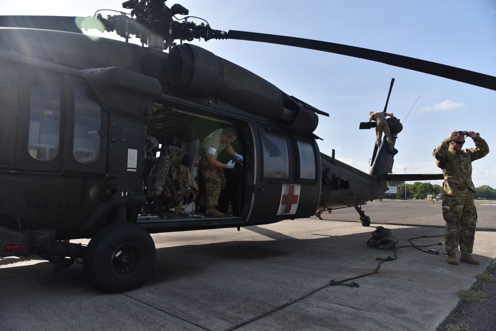 U.S. Army aircrew, assigned to the 1st Battalion 228th Aviation Regiment Air Ambulance Detachment at Joint Task Force-Bravo, conduct an aircraft maintenance inspection at Soto Cano Air Base, Honduras July 31, 2020. The Charlie Company of the 1-228th have been vital in providing emergency medical transportation throughout Honduras. Members of the 1-228th performed three life-saving aeromedical evacuations in the course of four weeks.