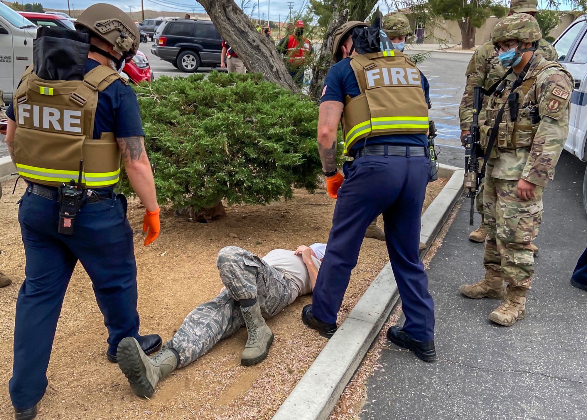 Members of the Edwards AFB Fire & Emergency Services and 412th Security Forces Squadron react during an active-shooter exercise at Edwards Air Force Base, California, Aug. 12 and 13. The two services employed the Rescue Task Force concept which aims to bring a quicker response time for victims.  (Air Force photo by Tech. Sgt. Felix Colon)