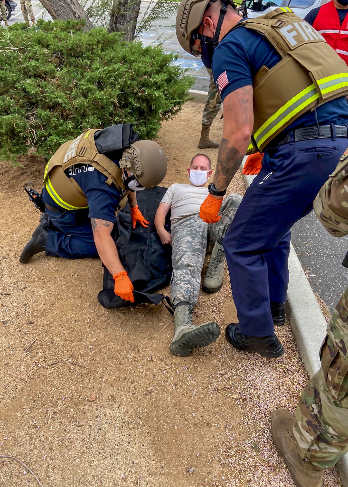 Members of the Edwards AFB Fire & Emergency Services and 412th Security Forces Squadron react during an active-shooter exercise at Edwards Air Force Base, California, Aug. 12 and 13. The two services employed the Rescue Task Force concept which aims to bring a quicker response time for victims.  (Air Force photo by Tech. Sgt. Felix Colon)