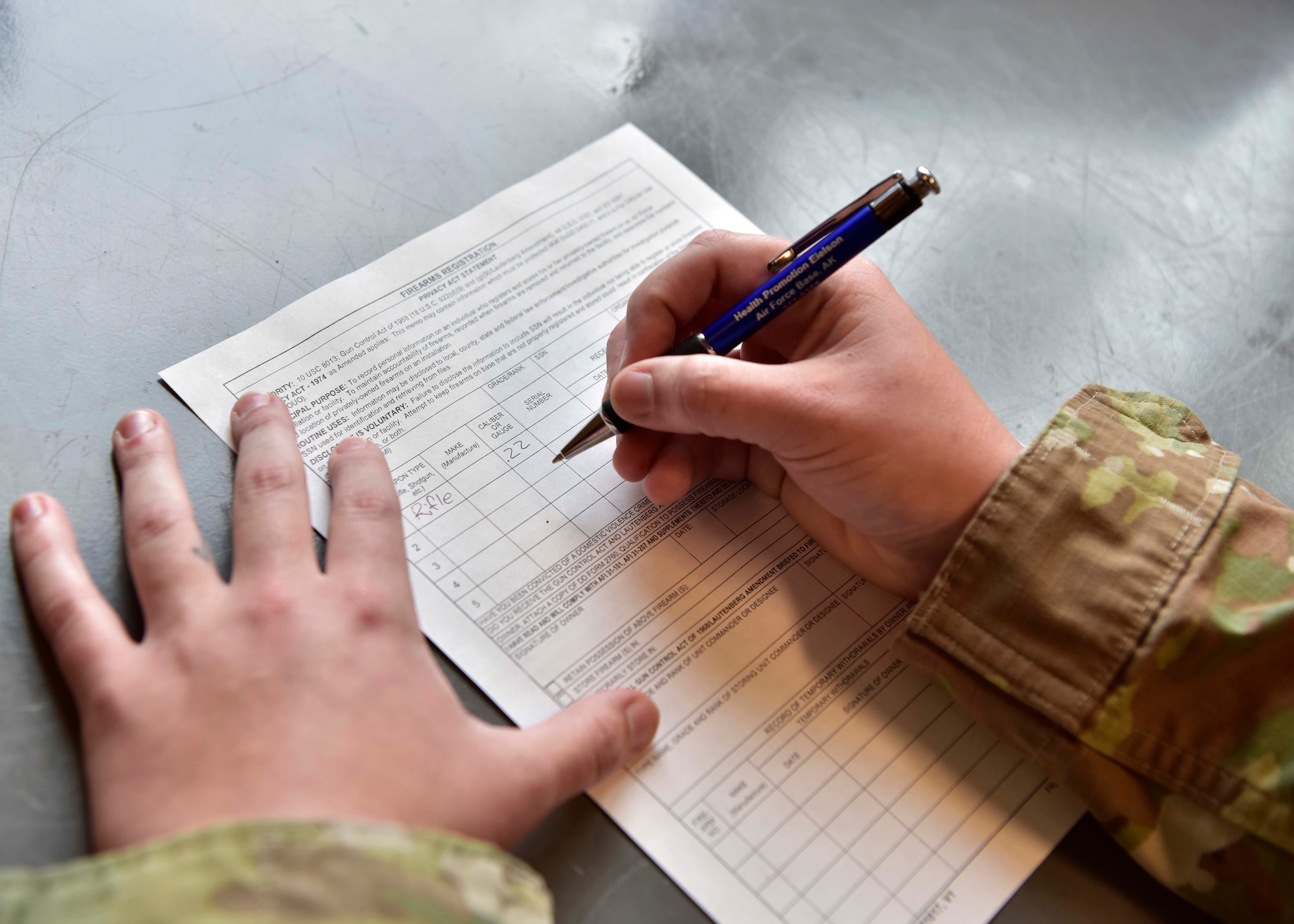 An Airman assigned to the 354th Fighter Wing completes an Air Force Form 1314 Firearms Registration on Eielson Air Force Base, Alaska, Aug. 21, 2020. Airmen are allowed to own firearms while living on base only if they register them with the 354th Security Forces Squadron to ensure proper accountability. (U.S. Air Force photo by Senior Airman Beaux Hebert)