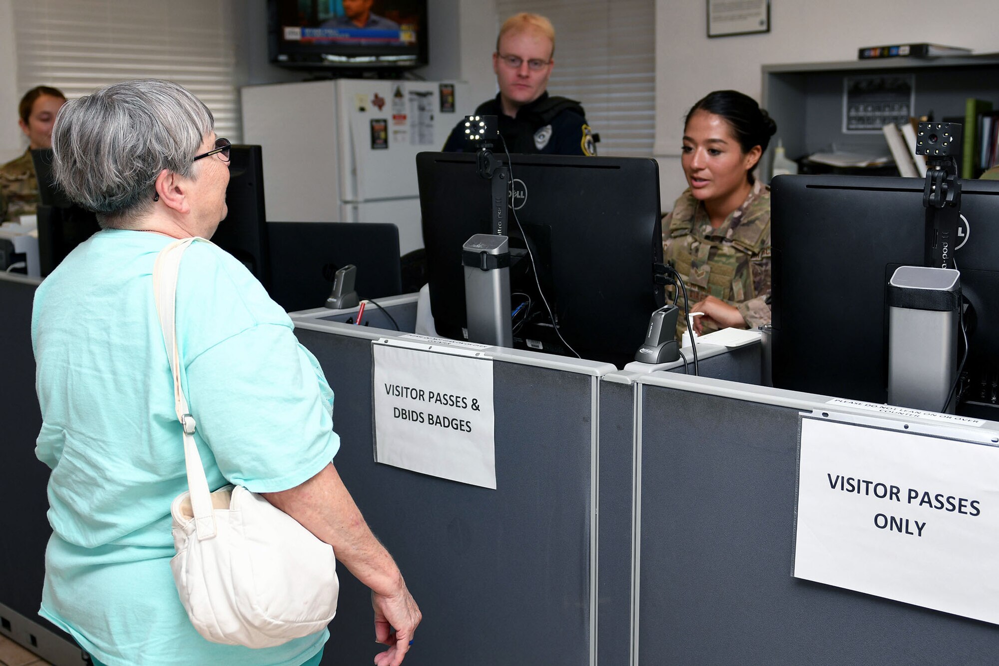 Gloria Golden, mother of the late Capt. Jonathan Golden, 39th Airlift Squadron C-130J Super Hercules pilot, gets her picture taken for her Defense Biometric Identification System ID card at Dyess Air Force Base, Texas, July 18, 2019.