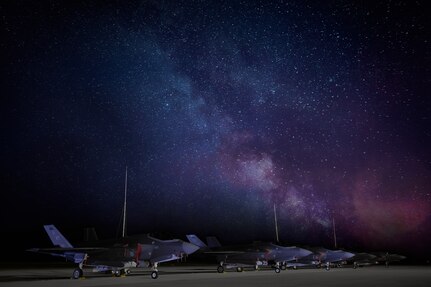 F-35A Lightning IIs assigned to the 134th Fighter Squadron, Vermont Air National Guard, on the flight line after a day of flying training missions at Northern Lightning 2020, Volk Field, Wis., Aug. 11, 2020. The annual exercise gives the wing and aircraft training in deploying and conducting combat missions in a joint environment, including F-22 Raptors, F/A-18 Super Hornets and F-16 Fighting Falcons. (This image was created by blending a series of multiple exposures.)