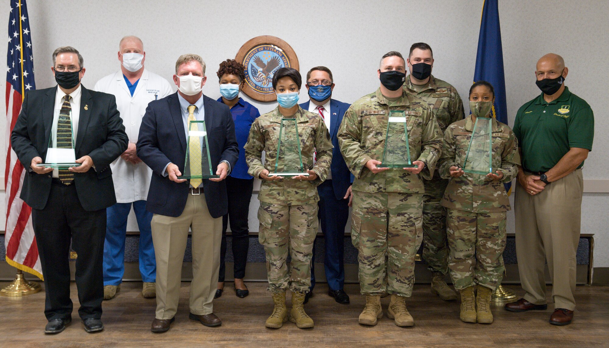 Recipients of the Department of Veteran’s Affairs Alternate Dispute Resolution Team Award pose for a photo with Overton Brooks Veteran’s Affairs Medical Center and 2nd Bomb Wing leadership at Overton Brooks VAMC in Shreveport, La., April 14, 2020.