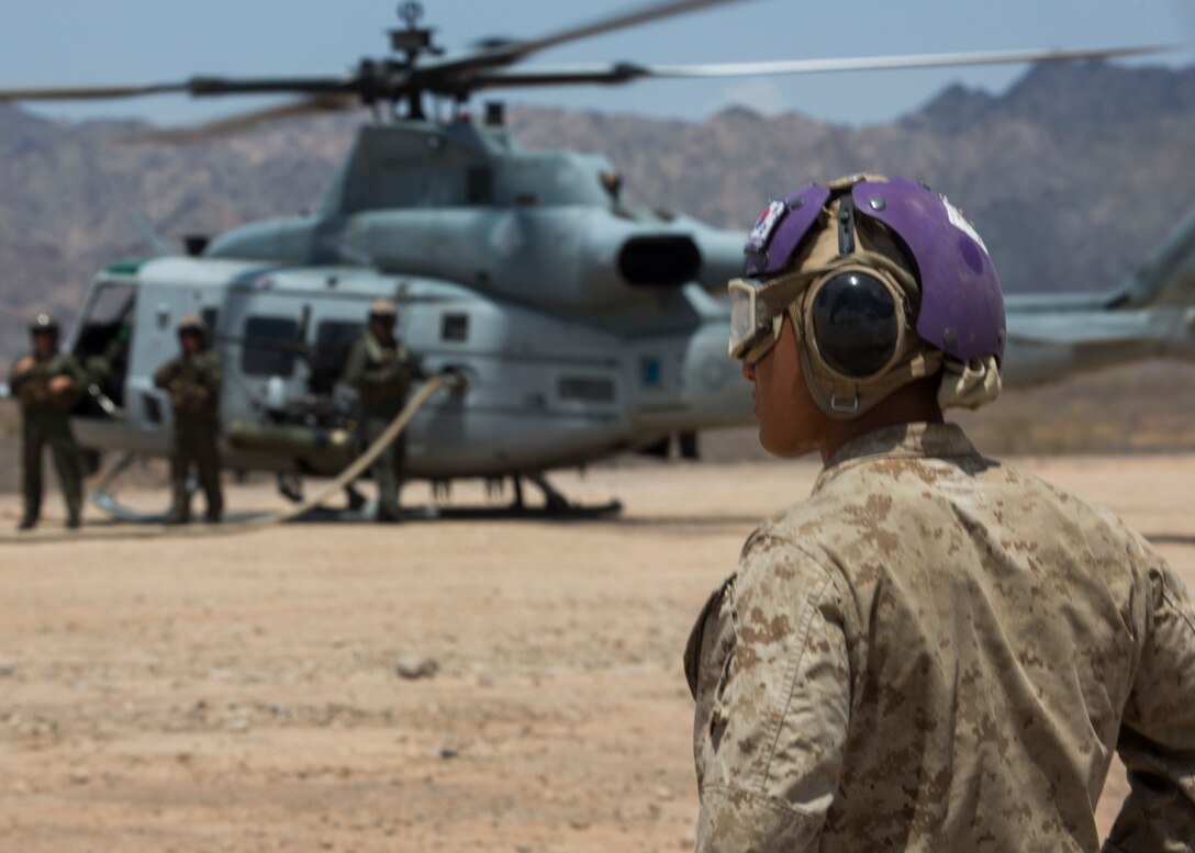 U.S. Marines with Marine Wing Support Squadron (MWSS) 373, Marine Aircraft Group 11, 3rd Marine Aircraft Wing, conduct forward aerial refueling point (FARP) operations at landing zone bull in Calif., July 31. FARP operations enable aircraft from all platforms across the Marine Corps to conduct aerial refueling, assault and transport missions without returning to their home base. FARP sites expedite mission accomplishment and supports the mission of the Marine Corps as a force in readiness when forward deployed. (U.S. Marine Corps photo by Lance Cpl. Juan Anaya)