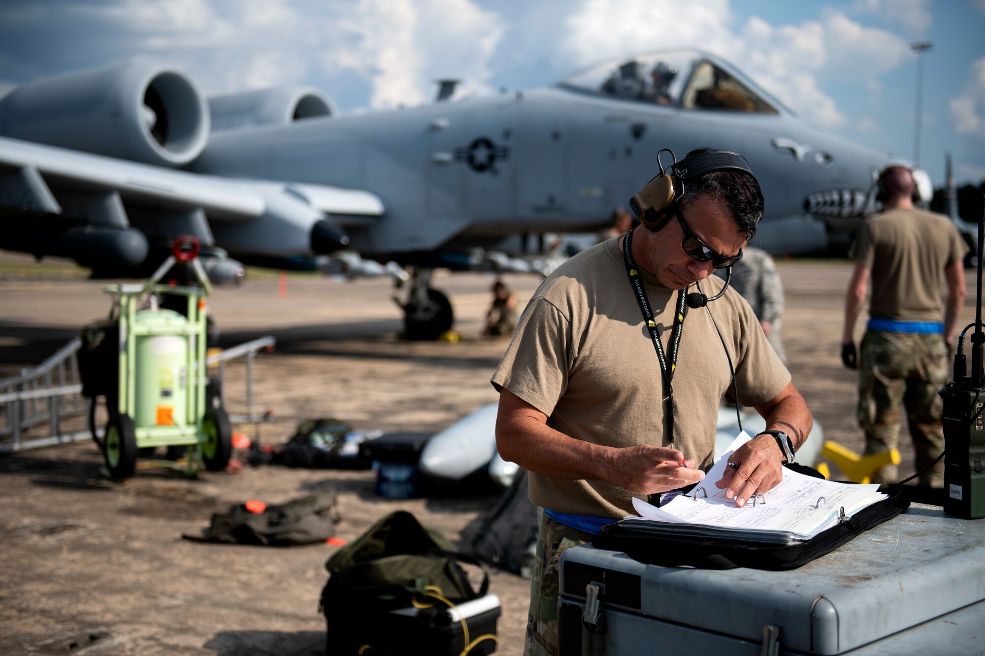 An Airman reads an instruction booklet