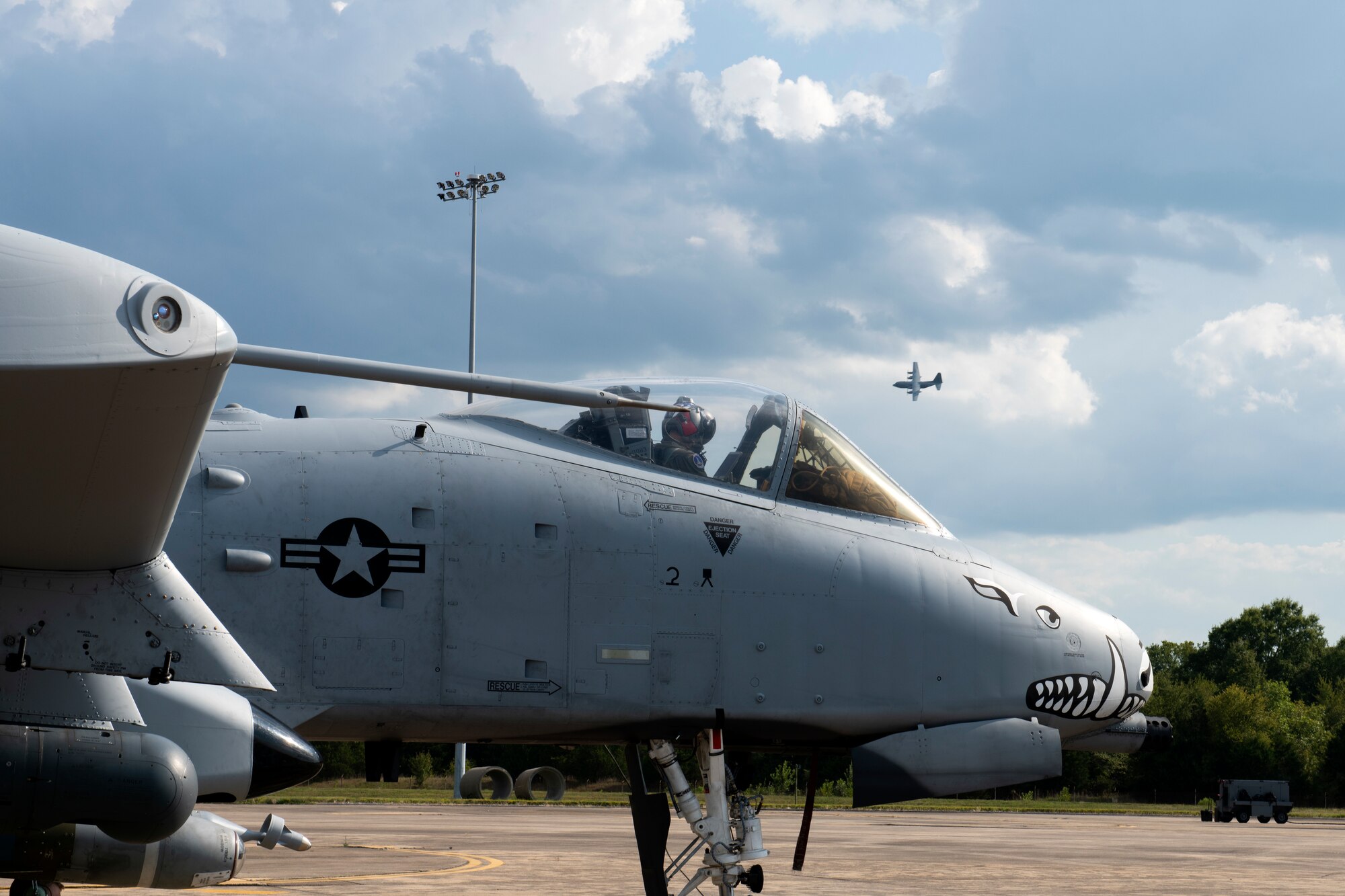 An aircraft sits on the flight line