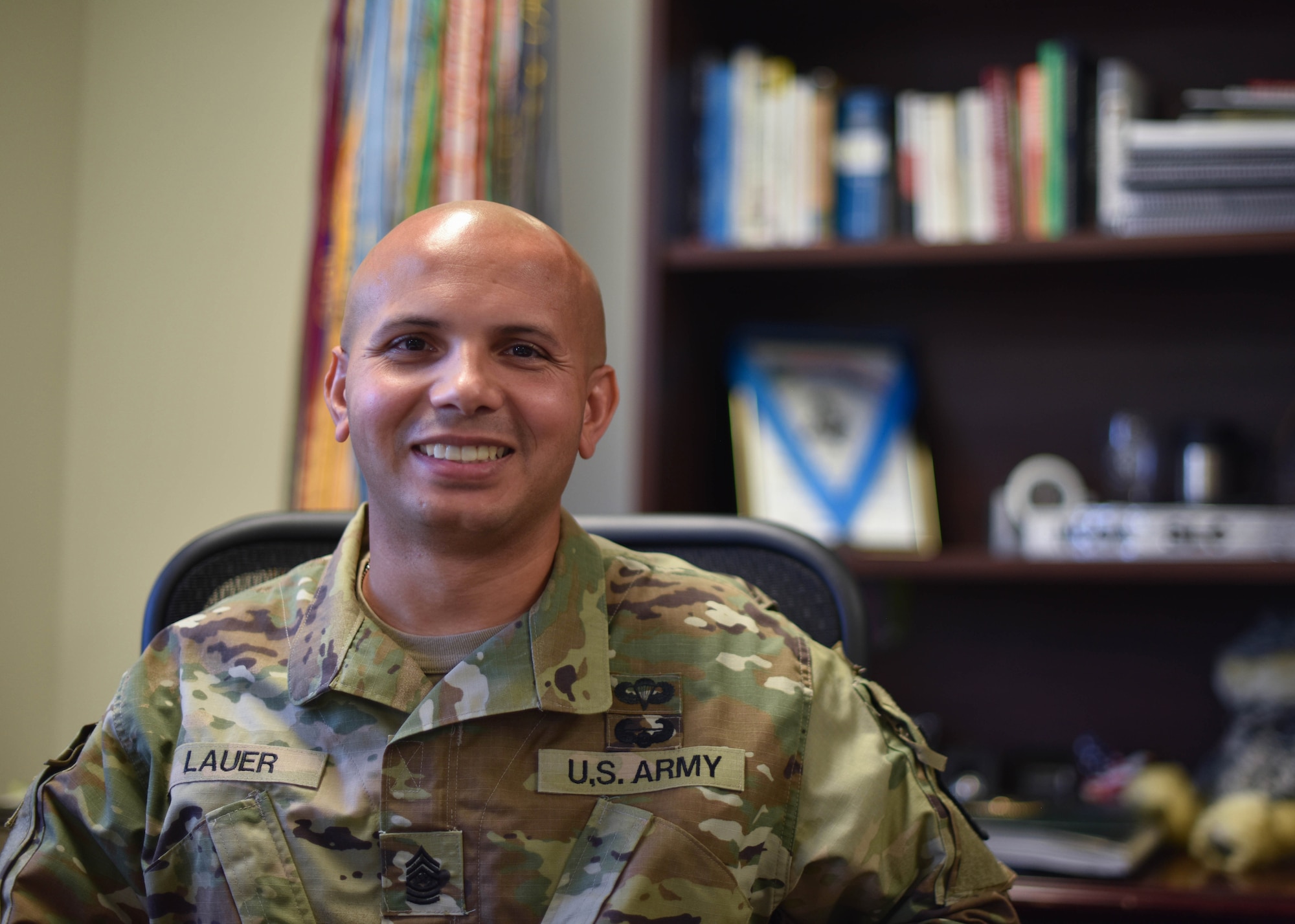 U.S. Army Command Sgt. Maj. Jason Lauer, command sgt. maj. of the 344th Military Intelligence Battalion, sits at his desk within the Army headquarters building on Goodfellow Air Force Base, Texas, July 30. As the senior enlisted advisor to the commander Lauer is responsible for developing the next generation of signals intelligence and cyber Soldiers. (U.S. Air Force Photo by Senior Airman Seraiah Wolf)