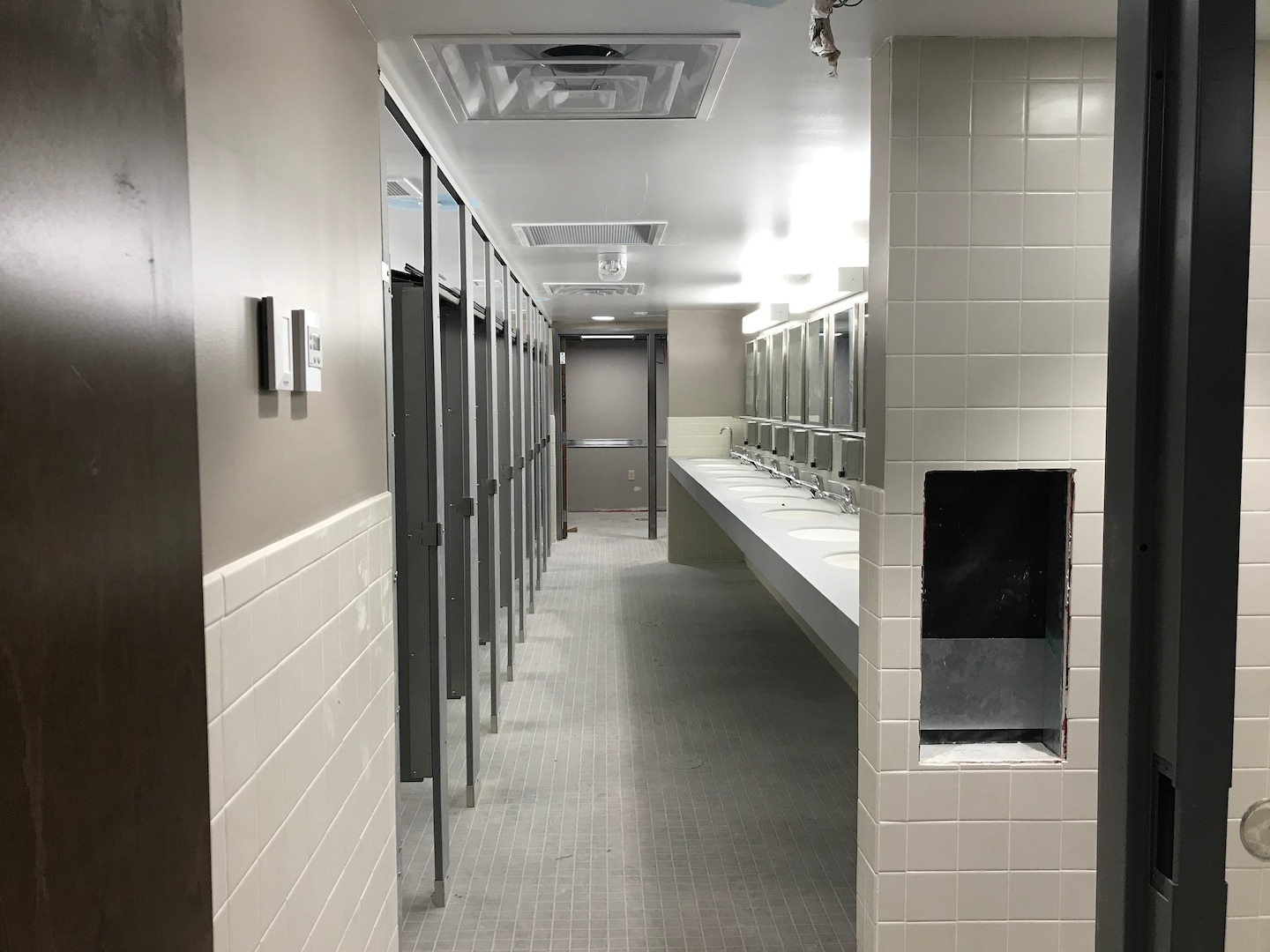 Line of laundry machines and dryers.
