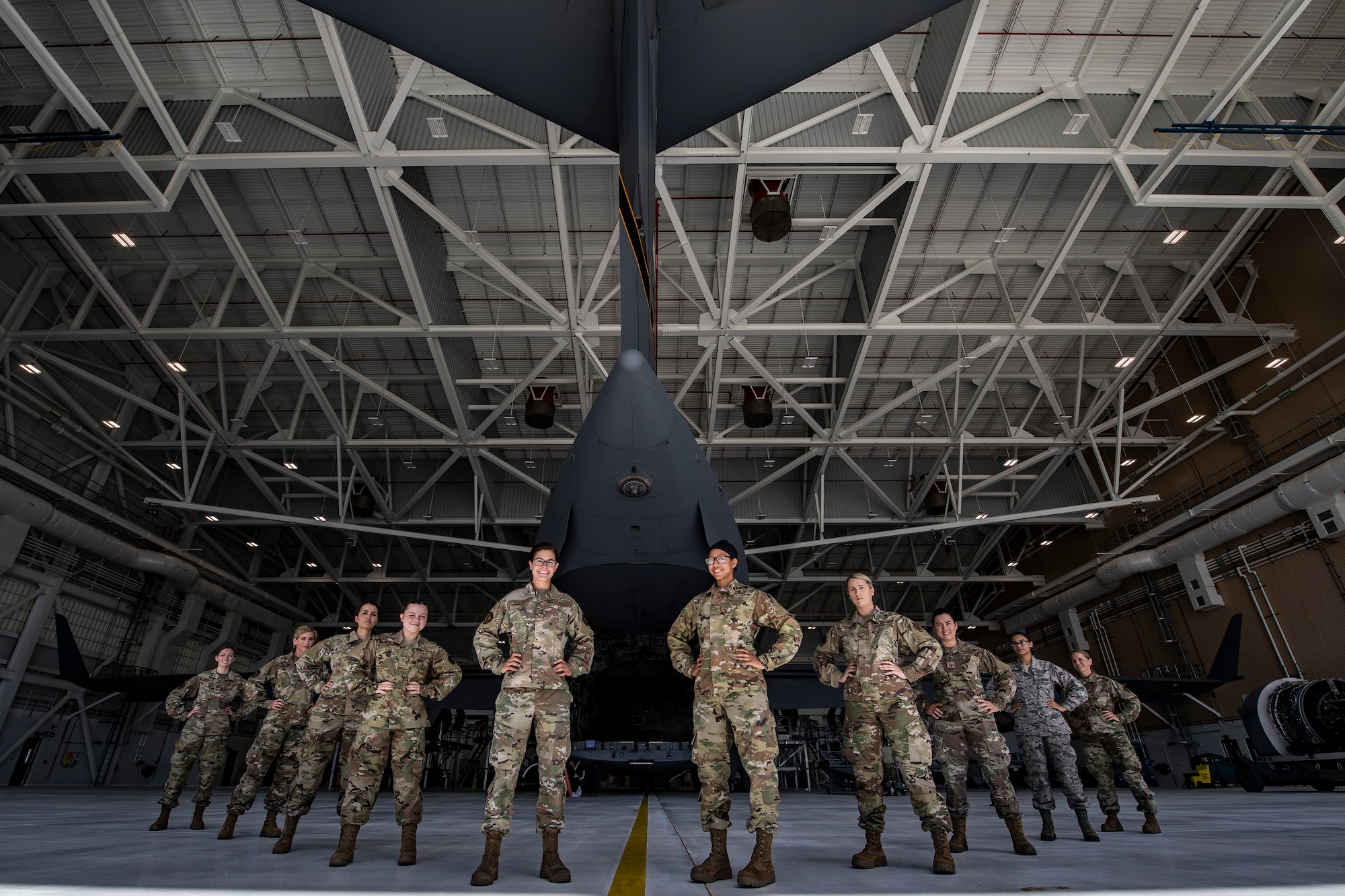 Female Airmen assigned to the 911th Maintenance Group pose for a photo near the ramp of a C-17 Globemaster III at the Pittsburgh International Airport Air Reserve Station, Pennsylvania, Aug. 20, 2020.