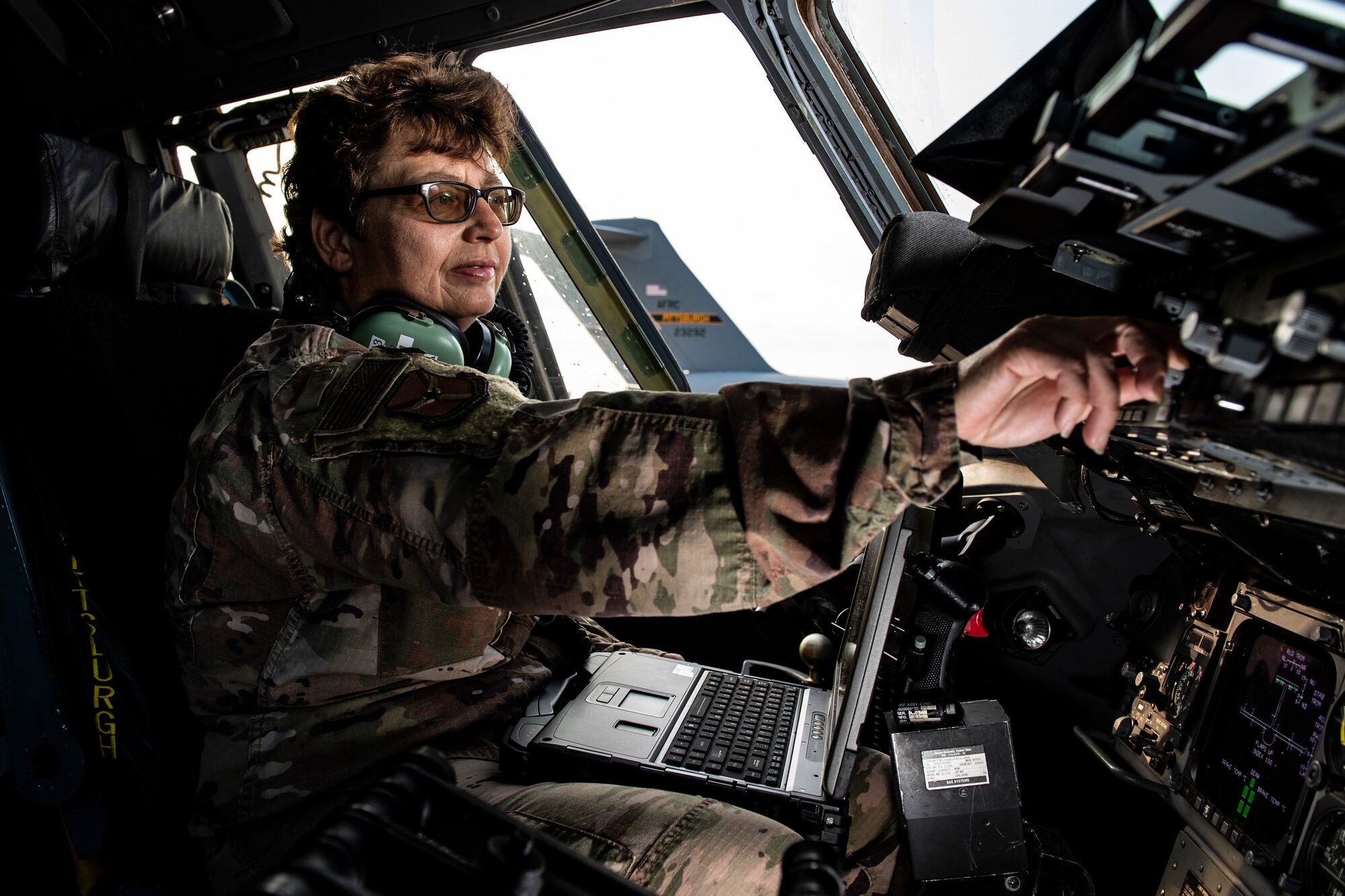 Master Sgt. Kimberly Juriga, 911th Aircraft Maintenance Squadron communications and navigations mission systems specialist, checks radio frequencies inside a C-17 Globemaster III at the Pittsburgh International Airport Air Reserve Station, Pennsylvania, Aug. 25, 2020.