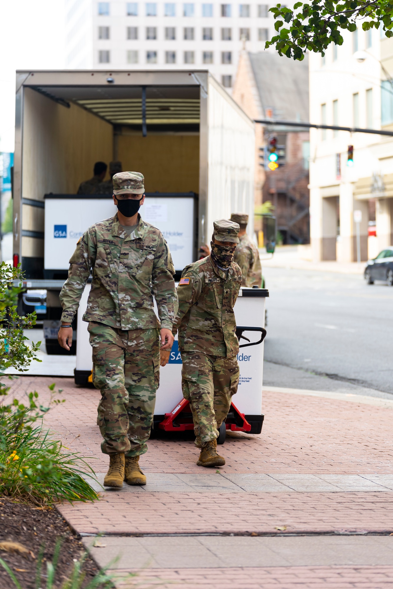 Soldiers from the Connecticut Army National Guard deliver Covid-19 testing kits from the Governor William A. O'Neill State Armory to a storage facility in Hartford, Conn., Aug. 14, 2020. The testing kits are being stored in the facility in preparation for a potential outbreak in the fall. (U.S. Air National Guard photo by Senior Airman Chanhda Ly)