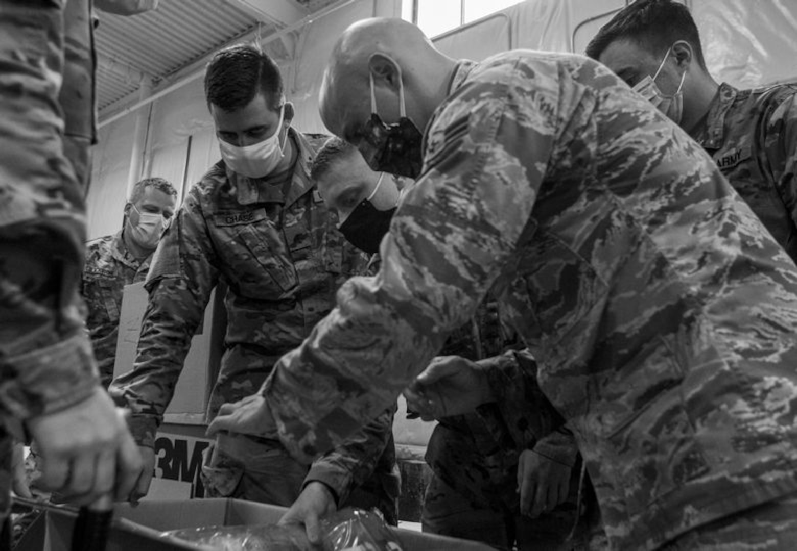 Seasoned Soldiers and Airmen with Task Force Distribution explain the process of packaging and distributing PPE to newly activated N.H. guardsmen at the TF Distro warehouse Aug. 25, 2020, in Concord.