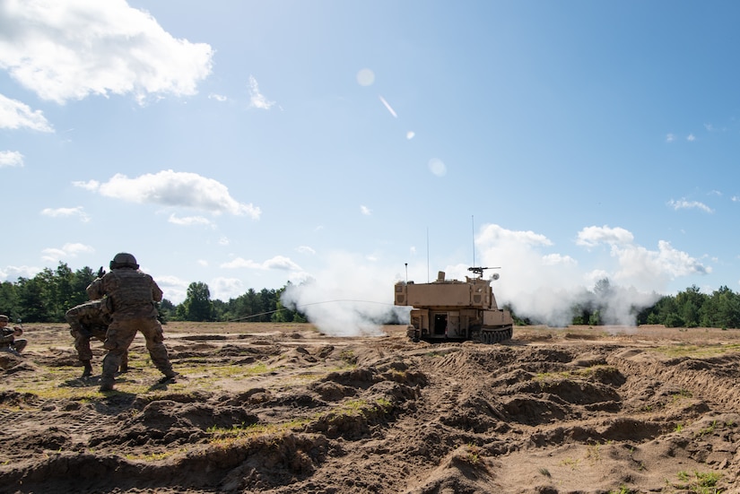 United States Army Soldier with the 1st Battalion 9th Field Artillery Regiment pulls the cord, firing the Paladin M109A7 weapons system at forward operating site Turon, Poland, July 22, 2020. Soldiers were preparing the weapon to complete certification tables between major exercises in Poland. (United States Army photo by Staff Sgt. Bethany Hendren)