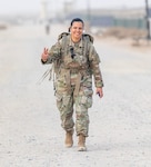 Capt. Jennifer Alvarez, company commander for the 42nd Infantry Division's Operation's Comany, does a 26.2 mile ruck march on her deployment to the Middle East March 18, 2020.