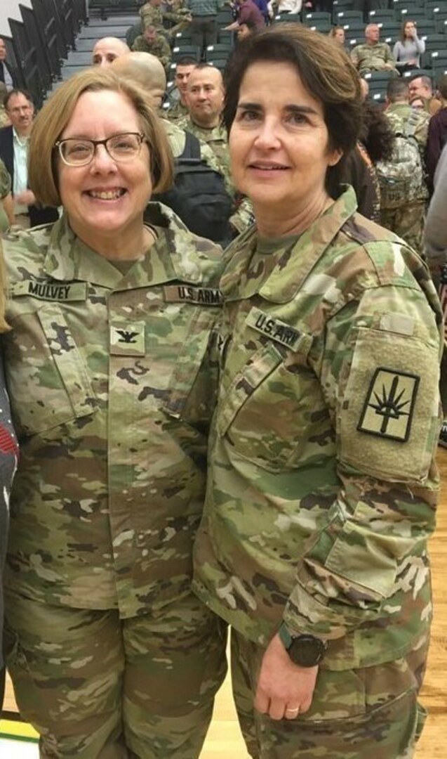 Col. Jude Mulvey stands with Col. Theresa Meltz at the 42nd Infantry Division's farewell ceremony on Jan. 11, 2020.