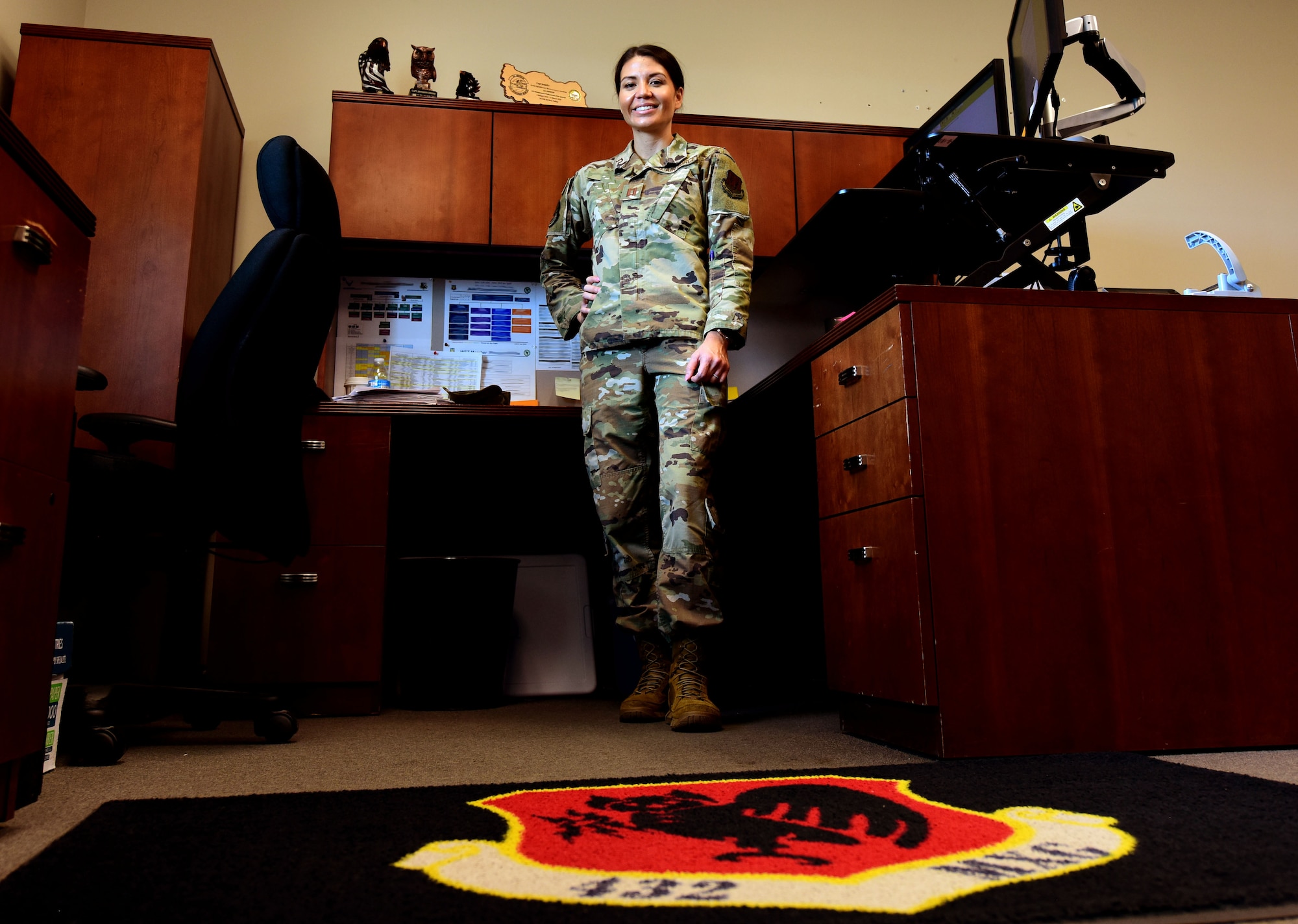 Capt. Jennifer smiles for a photo in her office.