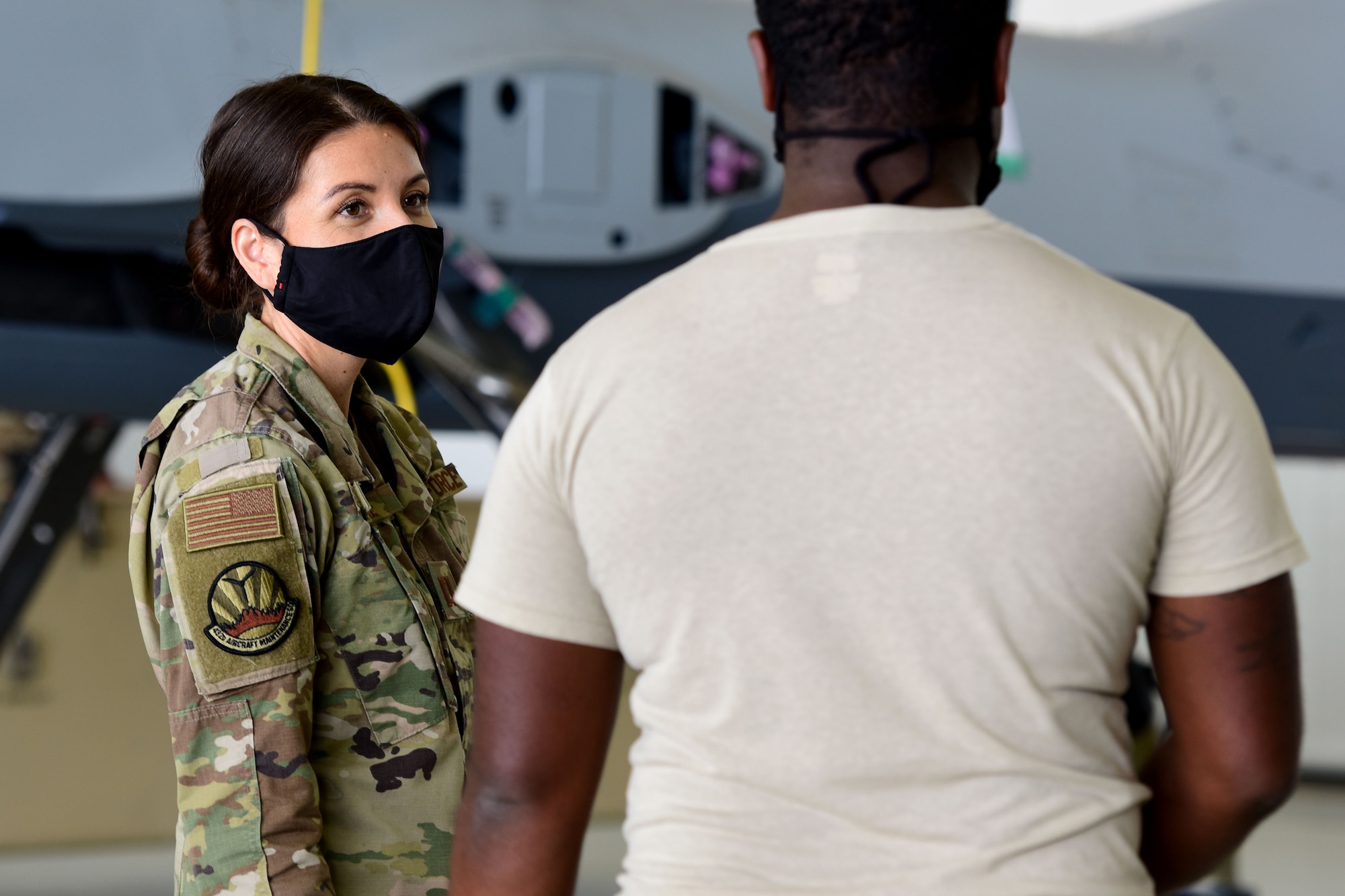 Capt. Jennifer speaks to a maintenance Airman.