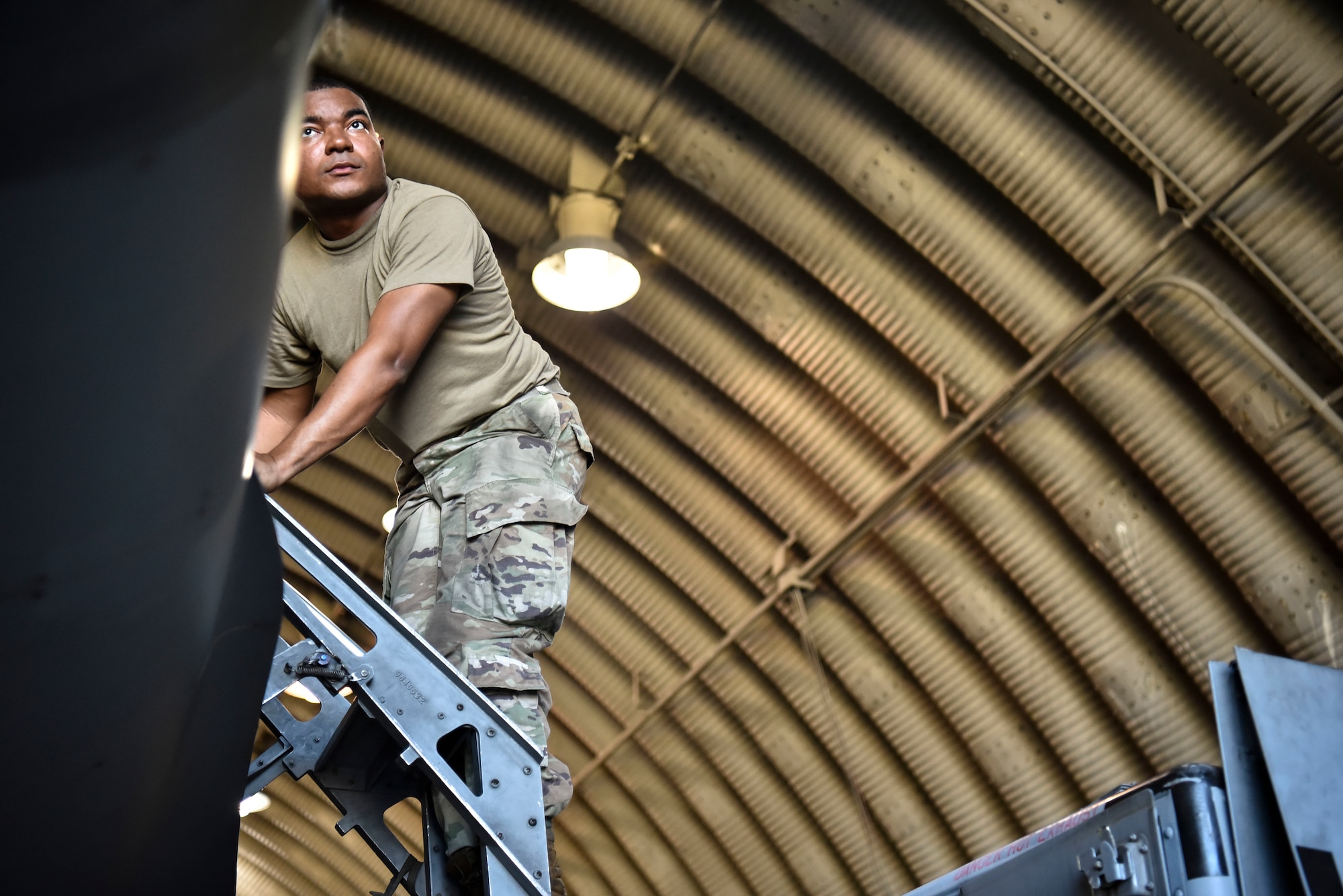 A photo of an Airman performing maintenance.