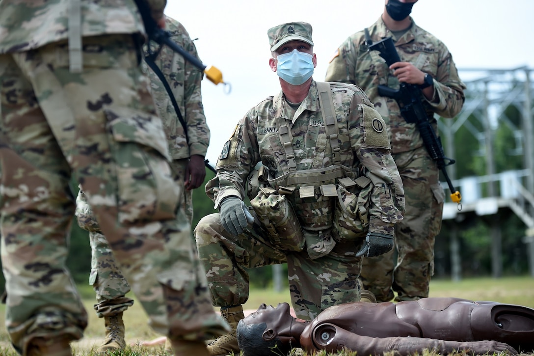 Army Reserve Sgt. 1st Class Andrew Banta, 1st Battalion, 338rd Regiment, gives instruction on Evaluating a Casualty to Soldiers from the 623rd Inland Cargo Transfer Company, during Operation Ready Warrior exercise, at Fort McCoy, Wisconsin, August 22, 2020.