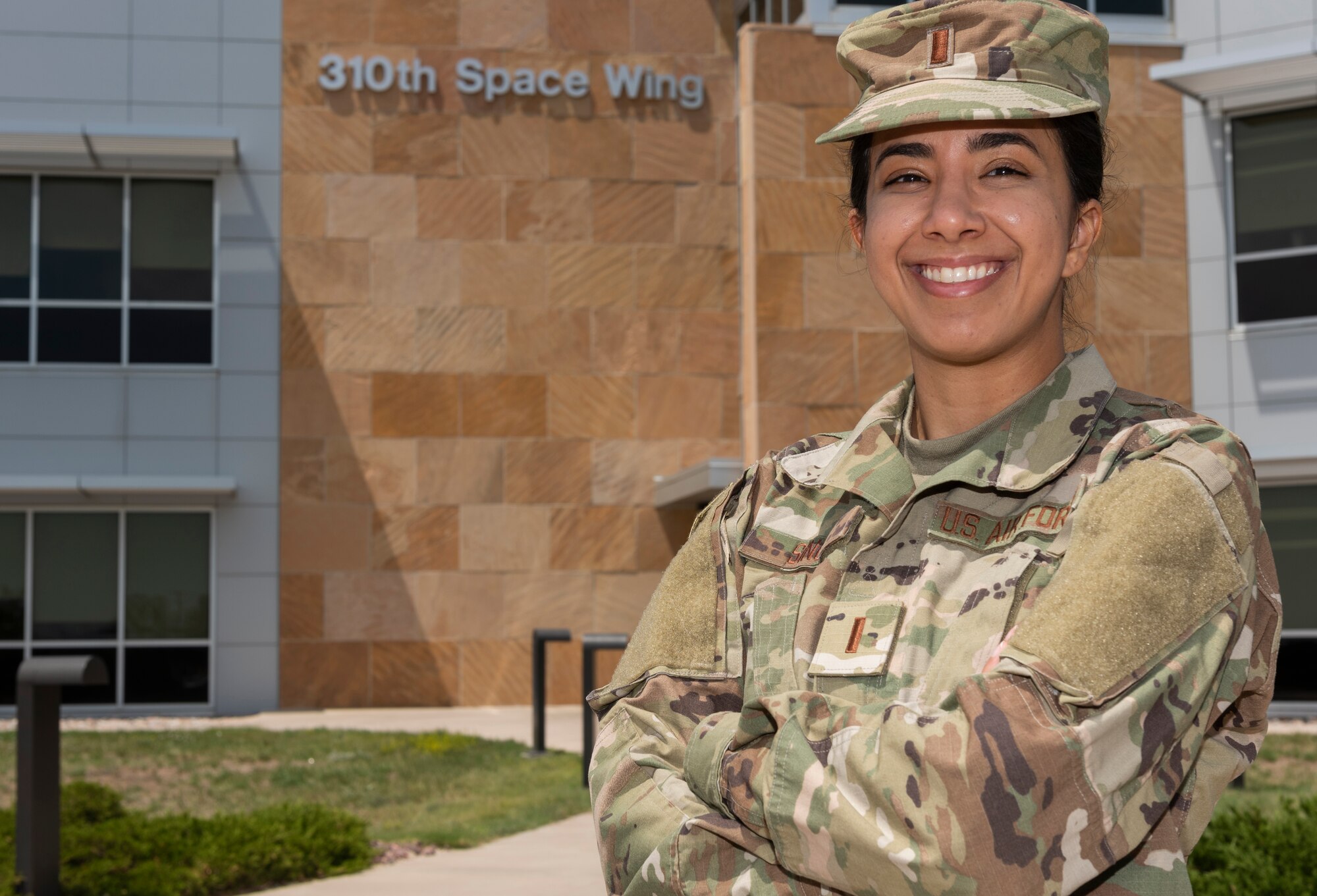 Picture of a woman standing with her arms crossed.