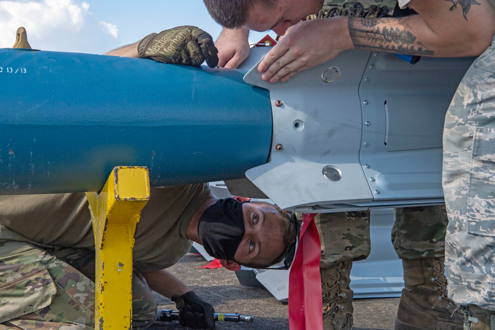 Airmen put together an inert munition