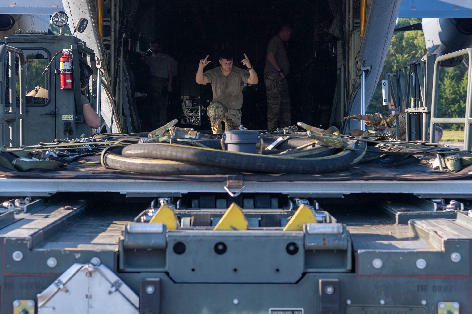 A piece of equipment is loaded onto a aircraft