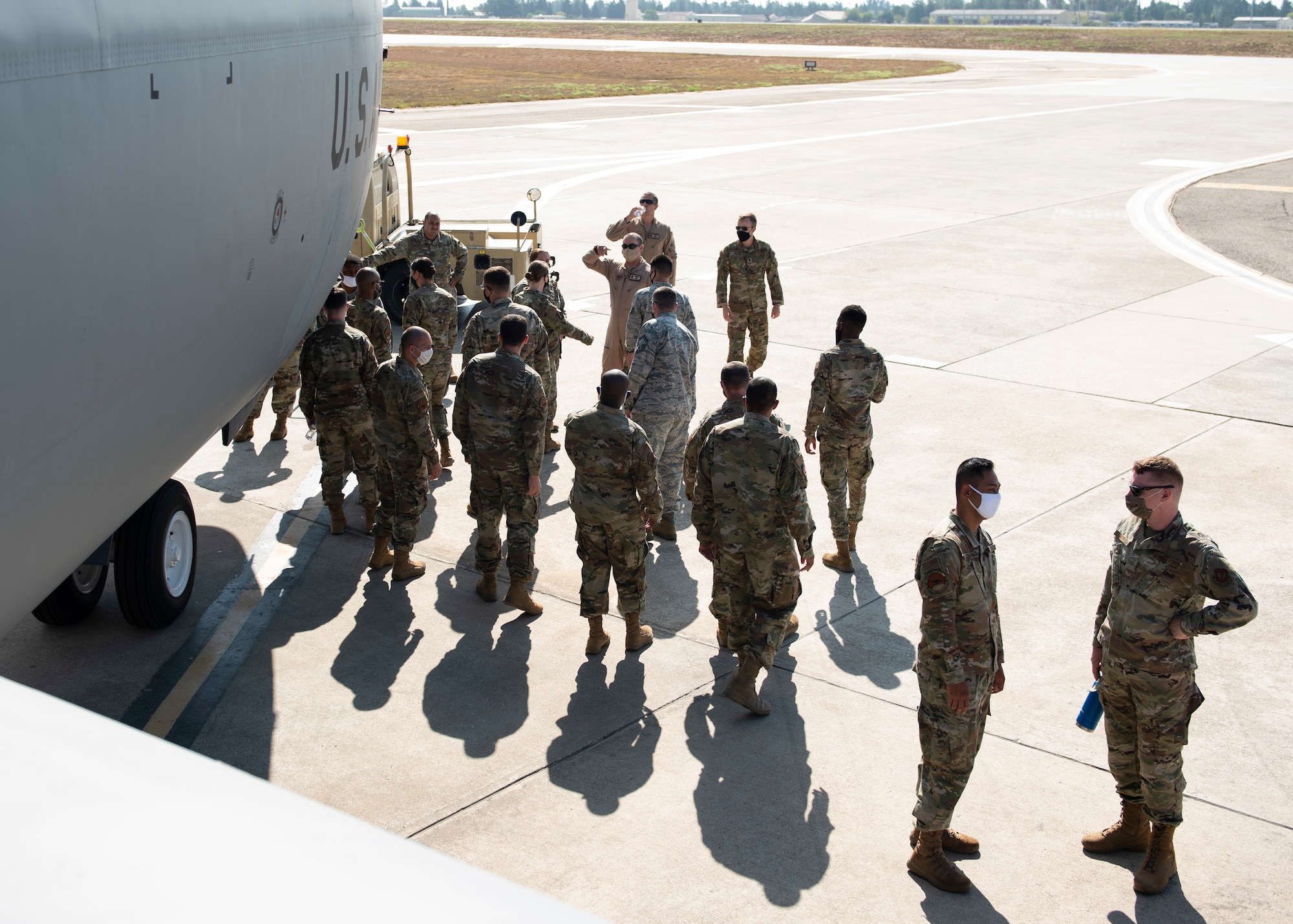 More than 20 Airmen gather near a parked KC-135 Stratotanker for a tour of the aircraft on the Incirlik Air Base flight line, August 17, 2020.
