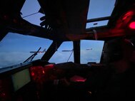 B-52s are seen flying in formation out of a B-52 cockpit window