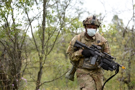 Michigan Army National Guard Soldiers from 1st Battalion, 125th Infantry Regiment, conduct eXportable Combat Training Capability (XCTC) and evaluation in coordination with First Army, at the All-Domain Warfighting Center, Camp Grayling, Michigan, Aug. 15, 2020.