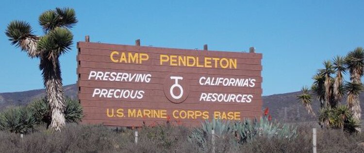 In an undated photo, the sign for Marine Corps Base Camp Pendleton, California, posted along Interstate Highway 5 reads, 'Preserving California's Precious Resources.' Camp Pendleton is the premier Fleet Marine Force training base on the West Coast.