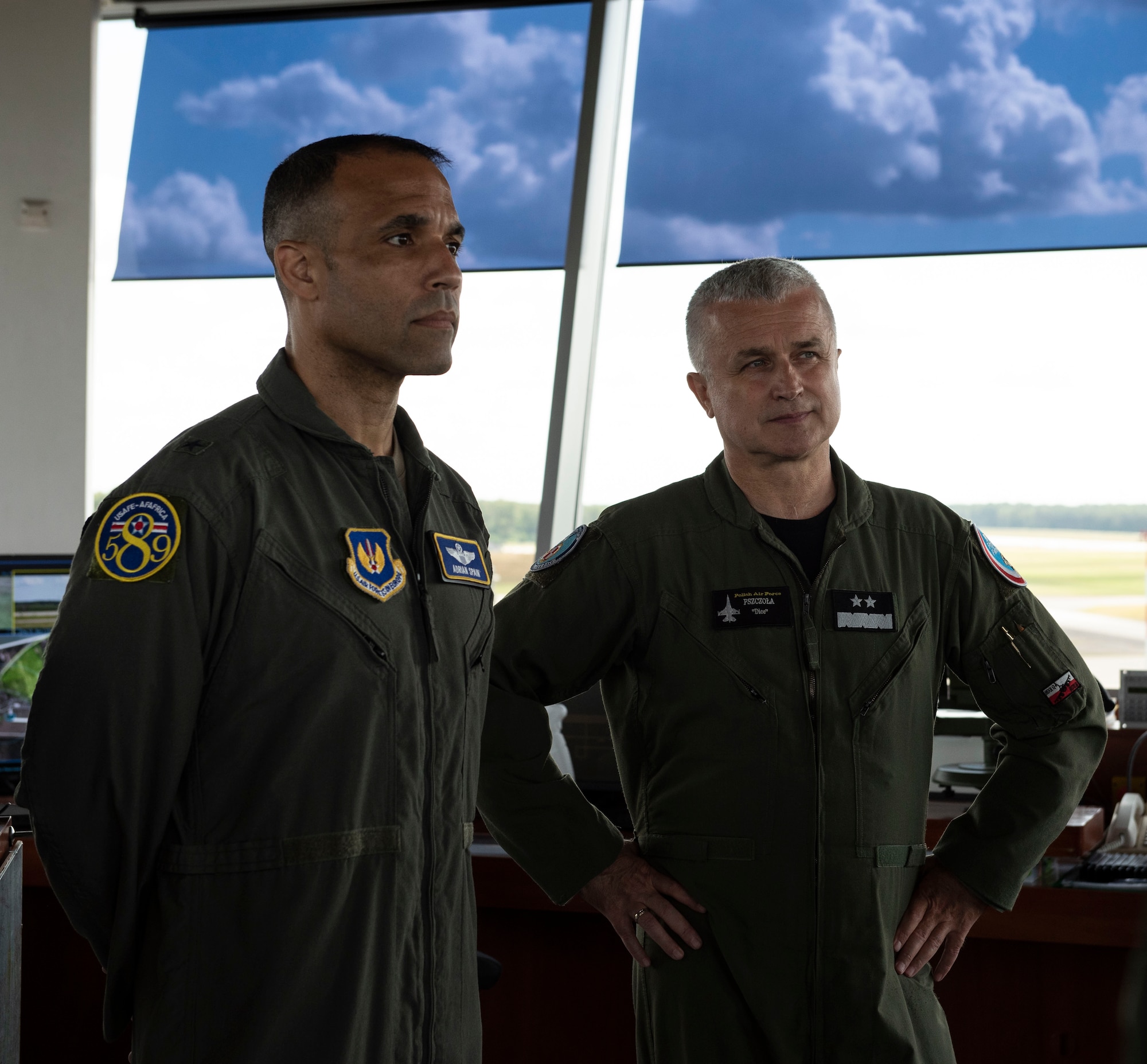 U.S. Air Force Brig. Gen. Adrian Spain, United States Air Forces in Europe and Air Forces Africa director of plans, programs and analyses, left, and Polish air force Maj. Gen. Jacek Pszczoła, inspector of the Polish air force, take a tour of the 32nd Tactical Air Base, August 24, 2020, at Łask AB, Poland. Spain and Pszczoła got a better understanding of the 32nd TAB mission and were able to ask questions, share different perspectives and learn from each other. (U.S. Air Force photo by Senior Airman Melody W. Howley)