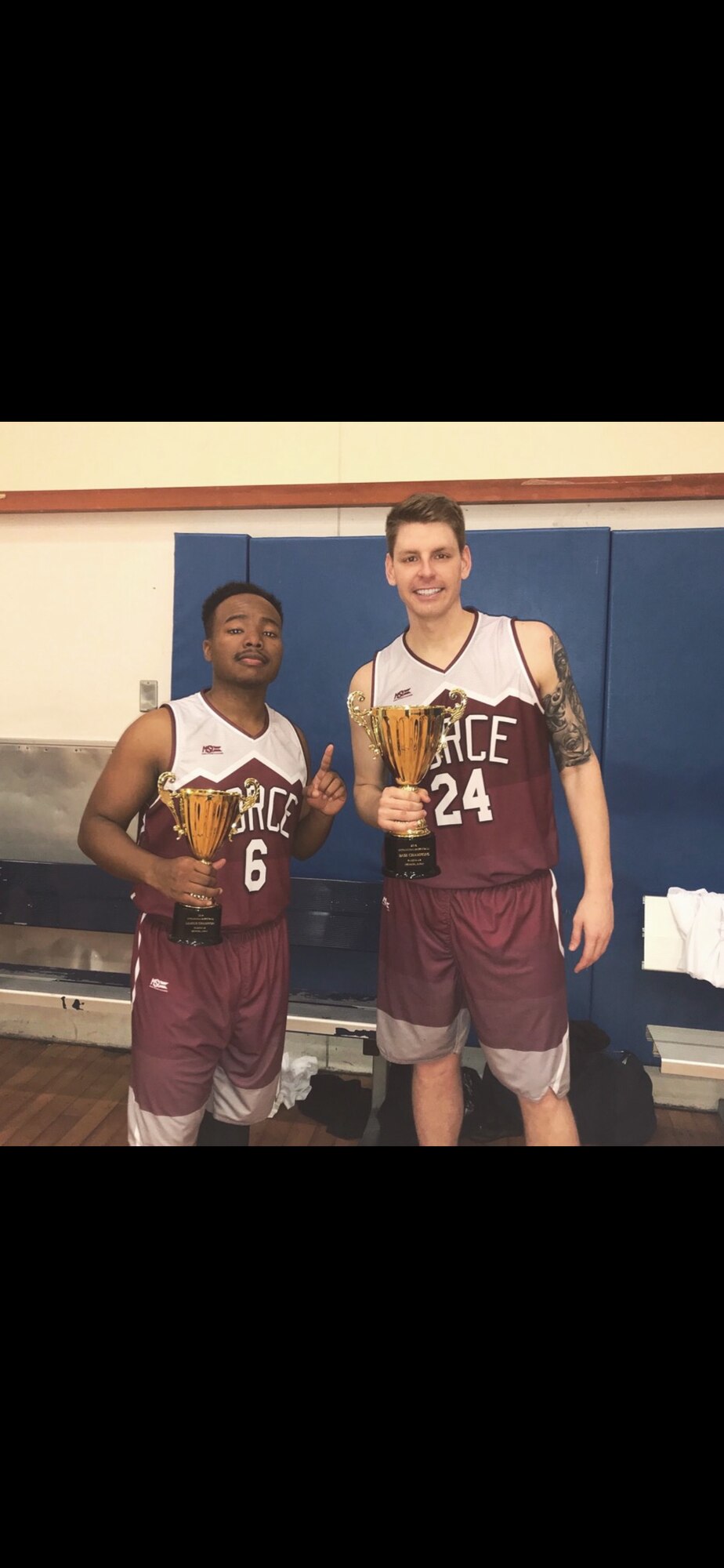 Two men in Basketball jerseys.
