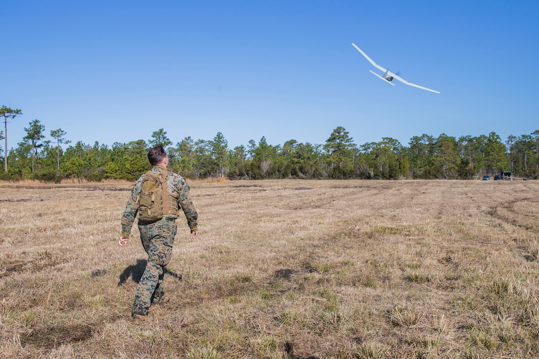 U.S. Marine Corps Cpl. Corey Dasilva, a fire support Marine with 2nd Air Naval Gunfire Liaison Company, II Marine Expeditionary Force Information Group, launches the RQ-20B PUMA Unmanned Aircraft System during a battalion exercise on Camp Lejeune, N.C., Dec. 12, 2019. The RQ-20B PUMA is a small hand-launched unmanned aircraft used for surveillance and intelligence gathering. (U.S. Marine Corps photo by Lance Cpl. Larisa Chavez)