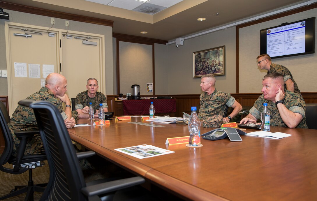 U.S. Marine Corps Lt. Gen.  David. G Bellon, commander of U.S. Marine Corps Forces, Reserve (MARFORRES) briefs the Assistant Commandant of the Marine Corps Gen. Gary L. Thomas in New Orleans, Aug. 11, 2020. Thomas toured MARFORRES to assess capabilities and structure during the novel Coronavirus pandemic. (U.S. Marine Corps photo by Sgt. Wesley Timm)