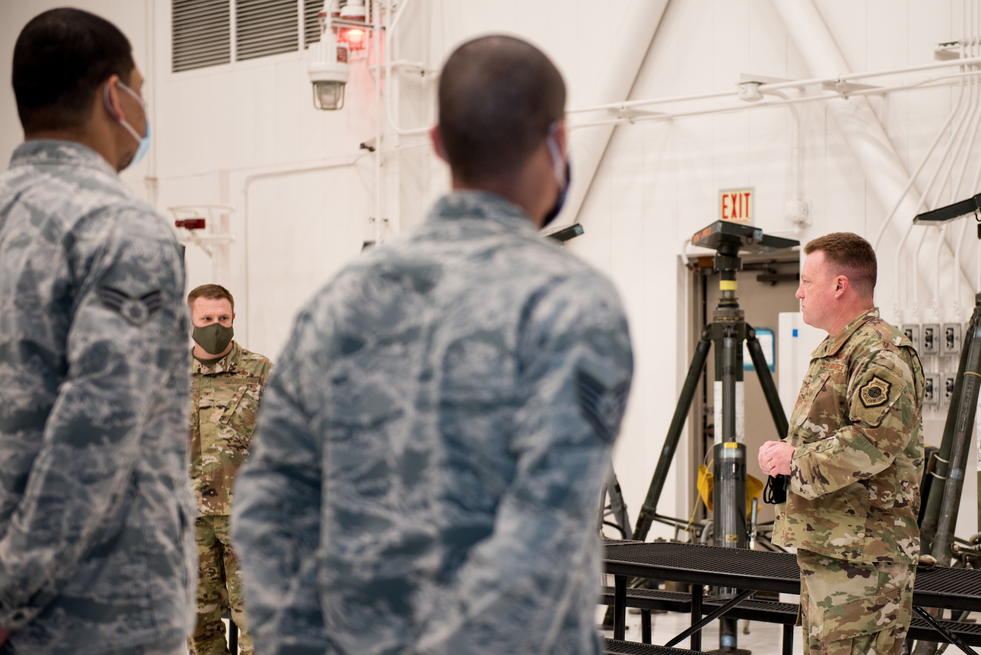 U.S. Air Force Col. Jeffrey Holland, 509th Maintenance Group commander, and Col. Jeffrey Schreiner, 509th Bomb Wing commander, speak to Airmen with the 509th Maintenance Group at Whiteman Air Force Base, Missouri, Aug. 14, 2020. Schreiner addressed questions from Airmen after presenting the Lt. Gen. Leo Marquez Award winner. (U.S. Air Force photo by Airman 1st Class Christina Carter)