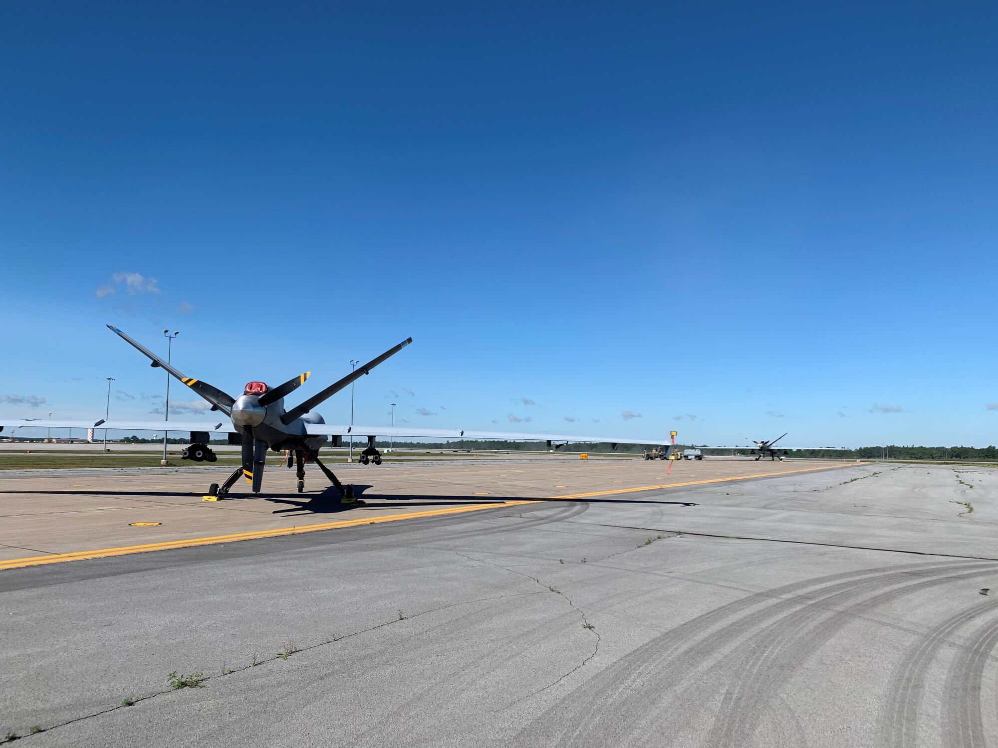 A 491st Attack Squadron MQ-9 Reaper sits on a flight line armed with AGM-114 Hellfire missiles ready to launch in support of Operation Northern Strike, July 30, 2020, on Wheeler-Sack Army Airfield, New York. Members from the 491st ATKS, a geographically separated unit from Holloman Air Force Base, New Mexico, work with Air National Guardsmen from the 174th Attack Wing, to increase their technical expertise, interpersonal skills and MQ-9 maintaining talents. (Courtesy photo)