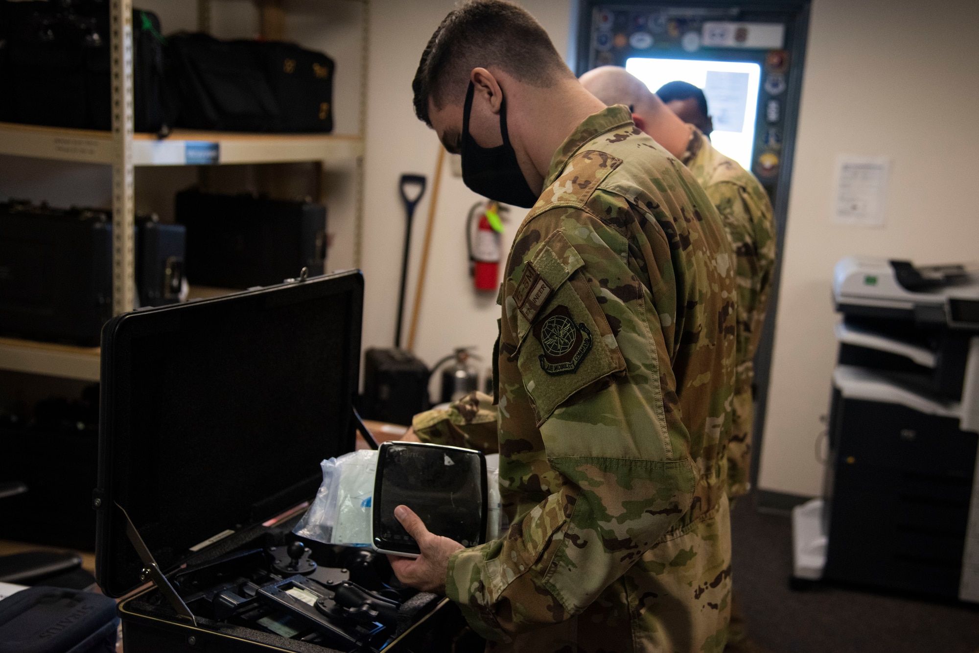 A 9th Airlift Squadron flight crew goes through their equipment prior to a mission Aug. 20, 2020, at Dover Air Force Base, Delaware. All equipment is centrally located in the One Stop office for easier epediting. (U.S. Air Force Photo by Airman 1st Class Jonathan Harding)