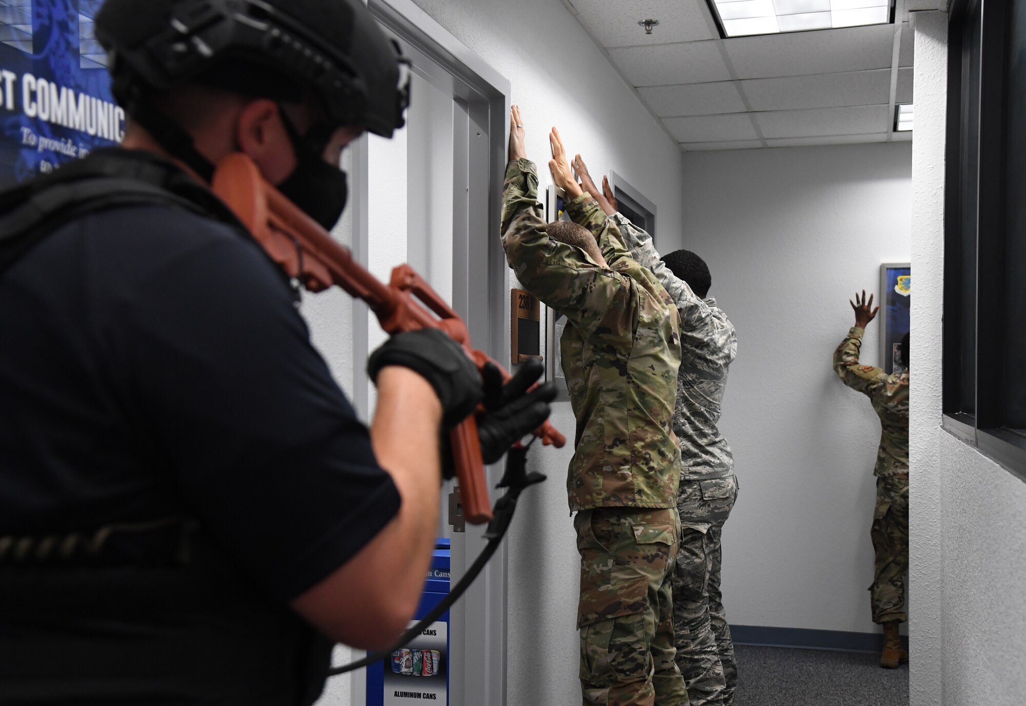 Tyler Sudduth, 81st Security Forces Squadron police officer, secures the 81st Mission Support Group command section inside the Sablich Center during an active shooter exercise at Keesler Air Force Base, Mississippi, Aug. 20, 2020. The scenario included two active duty Air Force members who simulated opening fire inside the Sablich Center in order to test the base's ability to respond to and recover from a mass casualty event. (U.S. Air Force photo by Kemberly Groue)