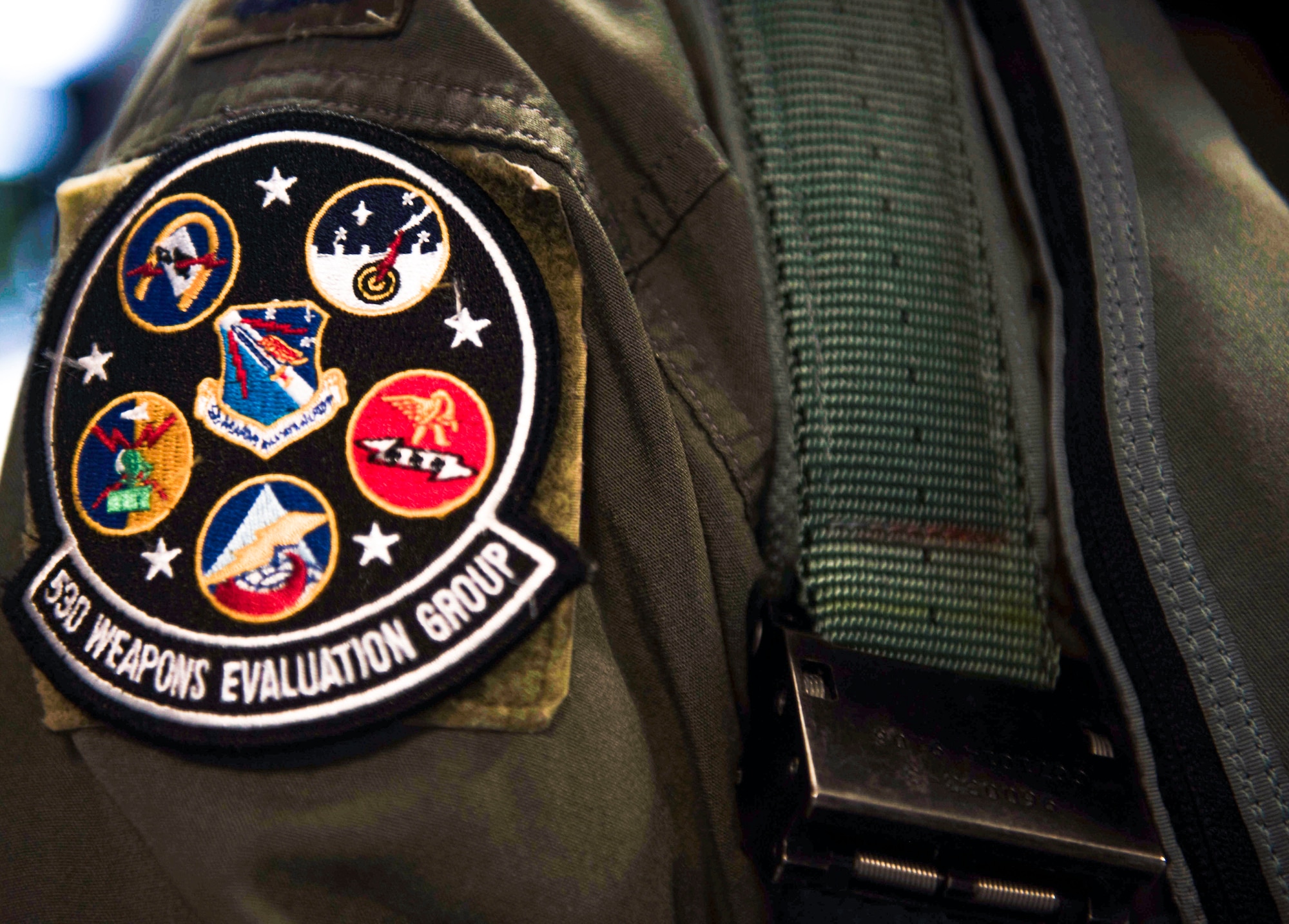 Pictured is a unit patch on the flight suit of U.S. Air Force Col. Nicholas Reed with the 53rd Weapons Evaluation Group, commander, at Tyndall Air Force Base, Florida, Aug. 21, 2020. Reed, and multiple other pilots, rushed to evacuate QF-16 aircraft to Shaw Air Force Base, South Carolina, in preparation for storm conditions. (U.S. Air Force photo by Staff Sgt. Magen M. Reeves)
